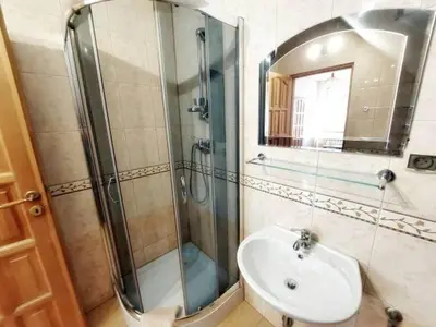 a bathroom with a shower and a sink and a mirror at Pokoje gościnne Zawoja Centrum Henryk Hadka in Zawoja