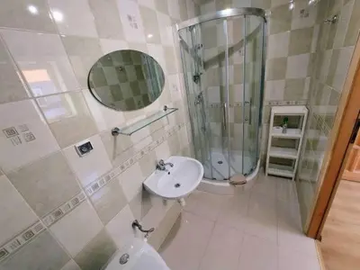 a bathroom with a sink and a shower and a toilet at Pokoje gościnne Zawoja Centrum Henryk Hadka in Zawoja