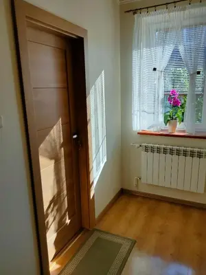 a room with a door and a window with a plant at Pokoje gościnne Zawoja Centrum Henryk Hadka in Zawoja