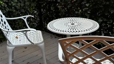two chairs and a white table and a table and chair at Cracow Apartments & Self check in & Free Parking in Kraków