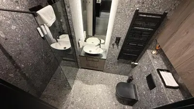 an overhead view of a bathroom with a toilet and sink at Cracow Apartments & Self check in & Free Parking in Kraków