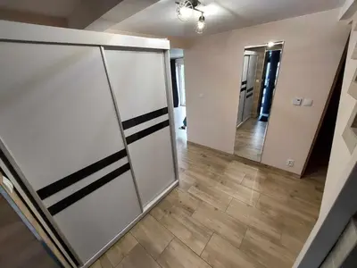 an empty room with a hallway with a large mirror at Ważka - apartament 6 osobowy in Krzeszów