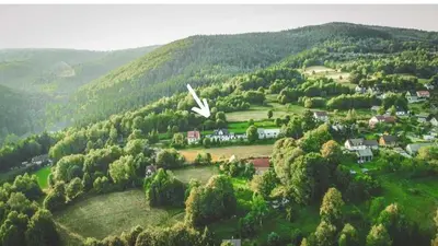 an aerial view of a village in the hills at Ważka - apartament 6 osobowy in Krzeszów
