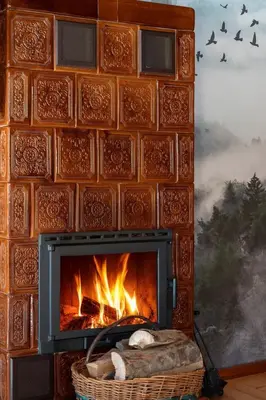 a living room with a table and a fireplace at Polana Słowikowa 5 star- domek w górach z jacuzzi, sauna,basen,ogród z lasem, kominek i narty in Stróża