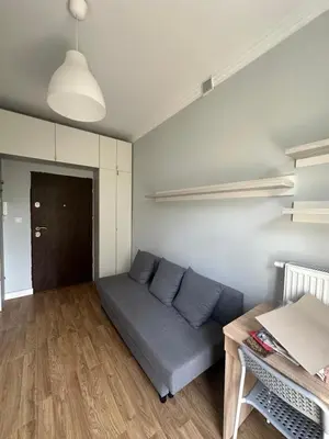 a living room with a couch and a table at Kujawska apartment in Kraków