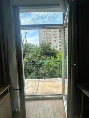an open door with a view of a balcony at Kujawska apartment in Kraków