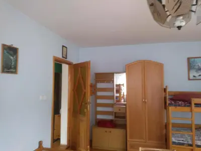 a room with a large window with curtains at Agroturystyka Boguska in Zawoja
