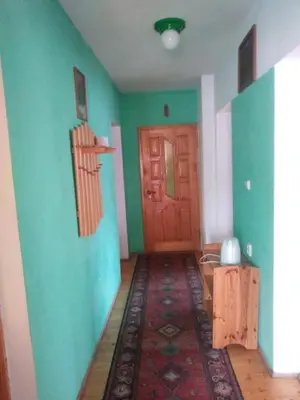 a dining room with a table and chairs and a window at Agroturystyka Boguska in Zawoja