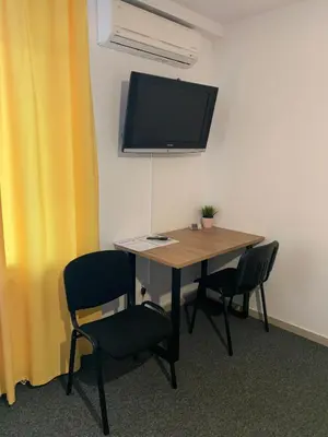 two beds in a hotel room with towels on them at Krakstop apartamenty in Kraków