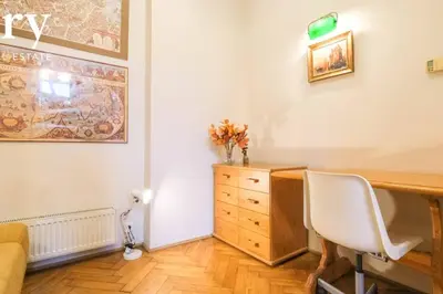 a room with a desk with a chair and a dresser at Big cozy apartment Free 1 parking in Kraków