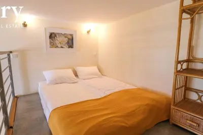 a small bedroom with a bed in a room at Big cozy apartment Free 1 parking in Kraków