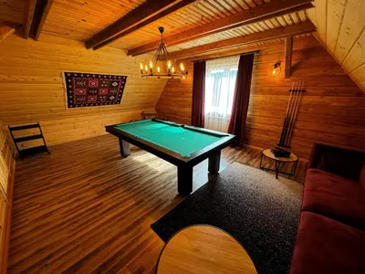 a room with a pool table in a cabin at Słoneczne Wzgórze w Kojszówce in Kojszówka