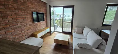 a living room with a couch and a tv at Apartament nad Wisłą in Kraków
