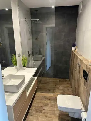 an empty room with a bed and a mirror at Apartament nad Wisłą in Kraków