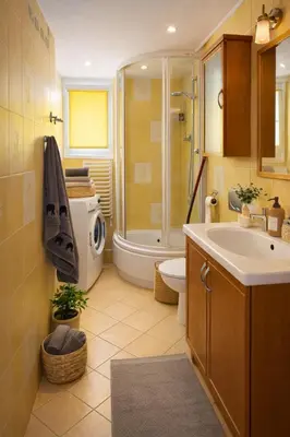 a bathroom with a shower toilet and a sink at Krakow Avenu 29 november 2 room in Kraków