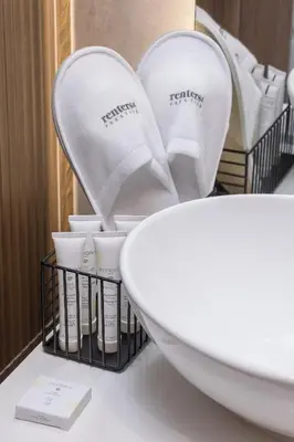 a bathroom counter with a white bowl and cups at Lux Kraków Apartment with Parking & AC just 1,5 km from Main Square by Renters Prestige in Kraków