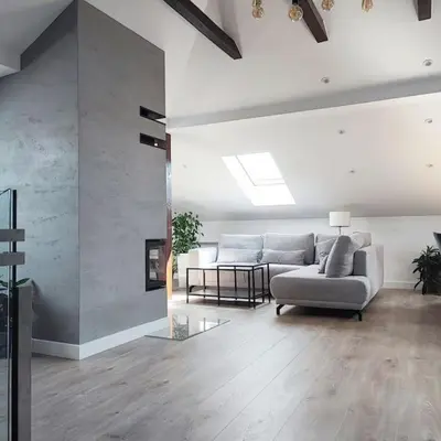 a living room with a couch and a table at Stylowy Apartament z ogrodem in Gorenice
