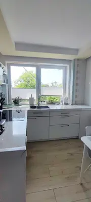 a bathroom with a tub and a toilet and a sink at Stylowy Apartament z ogrodem in Gorenice