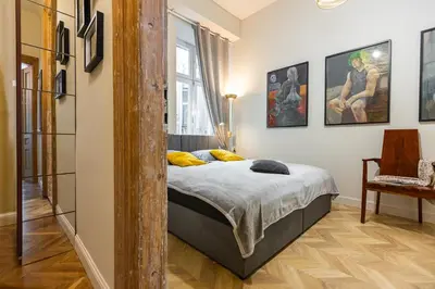 a bedroom with a bed and a window at Stylish apartment #2 in Krakow Old Town in Kraków