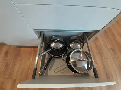 a glass table with four pots and pans on it at Cozy Apartment - B38 in Kraków