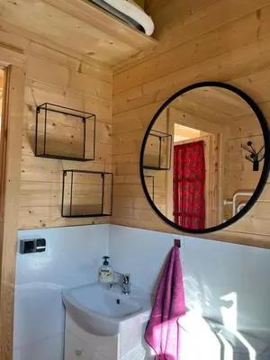 a bathroom with a sink and a mirror at Lavendowa oaza in Kocierz Rychwałdzki