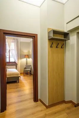 a room with a bed and a door to a bedroom at Old Town AC apartments Main Raiway Station in Kraków