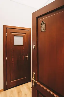 an open wooden door with a television in a room at Old Town AC apartments Main Raiway Station in Kraków