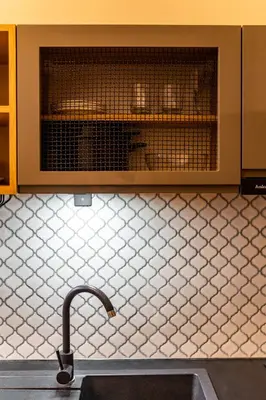 a kitchen sink with a faucet in front of a microwave at Old Town AC apartments Main Raiway Station in Kraków
