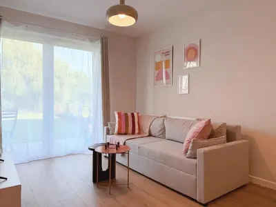 a living room with a couch and a table at Wieli Apartment in Wieliczka