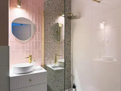 a bathroom with a sink and a mirror at Wieli Apartment in Wieliczka