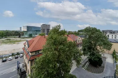 an overhead view of a city with buildings and trees at Wiślane Tarasy 2 0 Blue Studio by BookingHost in Kraków