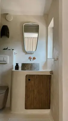 a bathroom with a sink and a mirror at hOMM domek nad jeziorem in Stryszów
