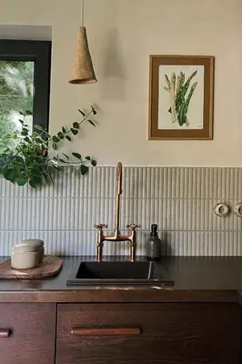 a kitchen sink with a faucet on a counter at hOMM domek nad jeziorem in Stryszów