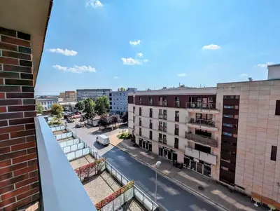 a view of a city street from a building at Riverside Base Zabłocie in Kraków