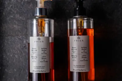 two bottles of wine sitting next to each other at Aparthotel Miodowa 25 in Kraków