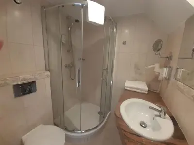 a bathroom with a shower and a sink and a toilet at Loft Apartment Old Town - G46 in Kraków