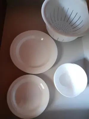 a group of white dishes sitting on a table at Loft Apartment Old Town - G47 in Kraków