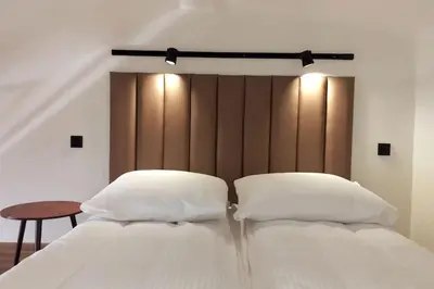 two white pillows sitting on a bed in a room at Loft Apartment Old Town - G47 in Kraków