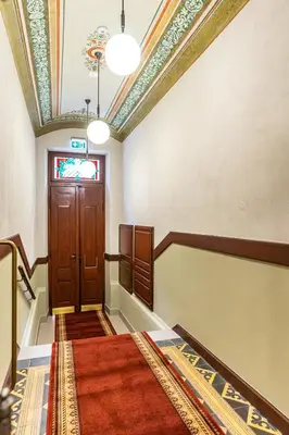 an empty hallway with a door and a window at Air-conditioned attic apartment Old Town Main Railway Station in Kraków