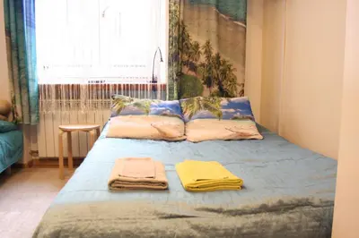 a bedroom with a bed with towels on it at Blue Traveler AC Apartment in Kazimierz in Kraków