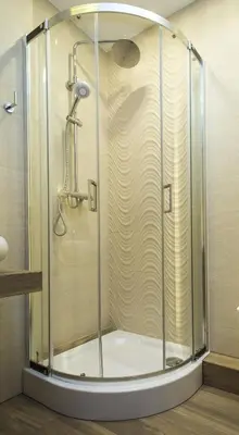 a shower with a glass door in a bathroom at Hotel nad Rabą - Bochnia in Bochnia
