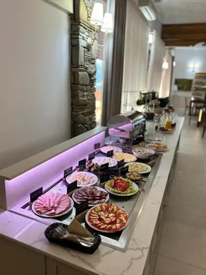 a buffet line with many plates of food on it at Hotel nad Rabą - Bochnia in Bochnia