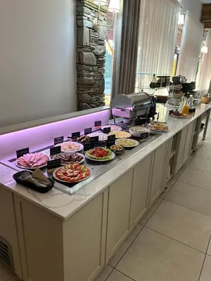 a buffet line with many different types of food at Hotel nad Rabą - Bochnia in Bochnia