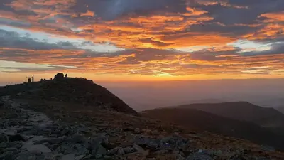 a sunset on the top of a mountain at Willa Babia Góra in Zawoja