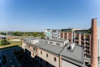 an aerial view of a building with a roof at Sky Loft Zabłocie in Kraków