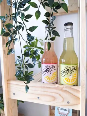 two bottles of lemonade sitting on a shelf at Apartament Jabłko-Mięta w Tymbarku in Tymbark