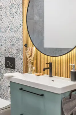 a bathroom with a white sink and a mirror at Kraków Główny Apt - Top Location, Park&Tram nearby - by Rentujemy in Kraków