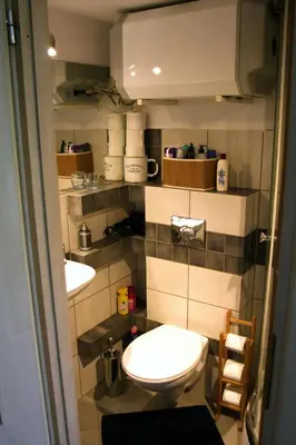 a bathroom with two sinks and a toilet at Smallest Spot in Town, City Center in Kraków