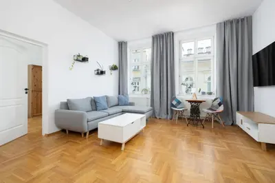 a living room with a couch and a table at 1-bedroom Apartment - Radziwiłłowska 14 Street in Kraków
