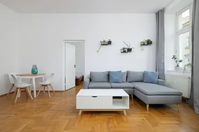 a living room with a couch and a table at 1-bedroom Apartment - Radziwiłłowska 14 Street in Kraków